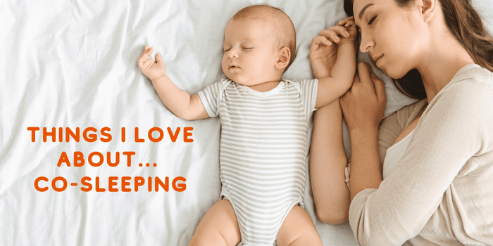 Mother and baby asleep on bed