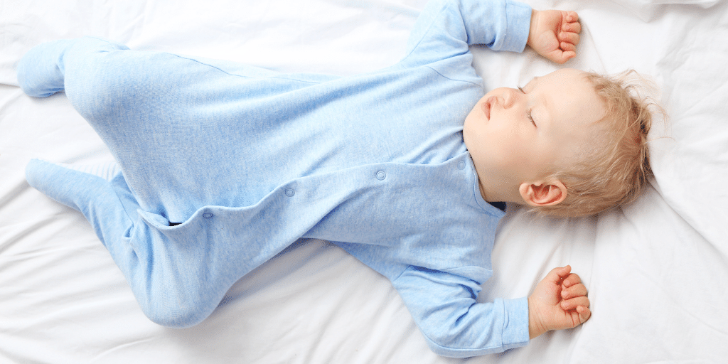 baby sleeping in cot 6-12 months