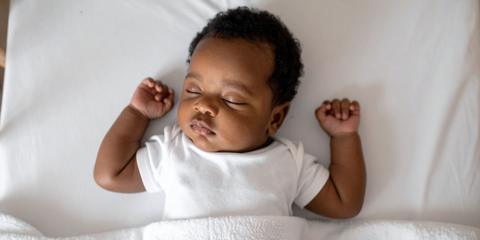Sleeping baby, illustrating a guest post on what the evidence says about sleep training and baby sleep