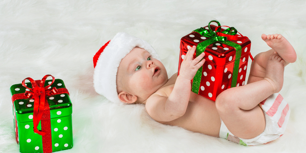baby wearing Santa hat