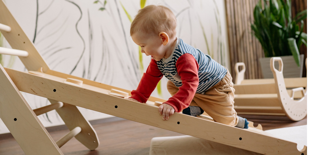 Baby asleep in a cot at nursery, illustrating why nursery naps look different from naps at home