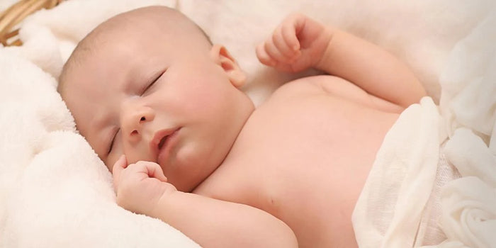 what to do when baby rolls on tummy when asleep