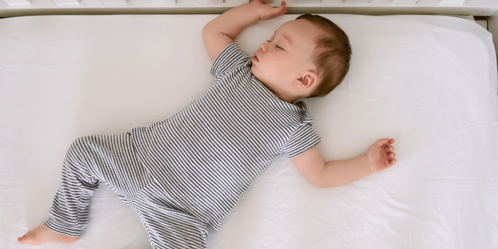 Baby sleeping in a cot